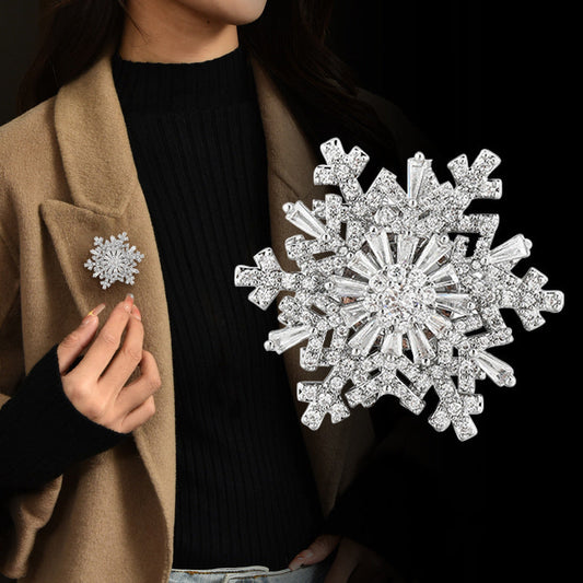 Broche de luxe à flocon de neige rotatif