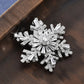 Broche de luxe à flocon de neige rotatif