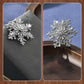 Broche de luxe à flocon de neige rotatif