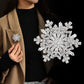 Broche de luxe à flocon de neige rotatif