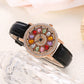 Montre à cadran rotatif pour femme avec diamants simulés colorés