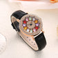 Montre à cadran rotatif pour femme avec diamants simulés colorés