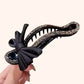 Barrette à cheveux élégante et scintillante avec nœud noir pour chignons