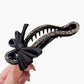 Barrette à cheveux élégante et scintillante avec nœud noir pour chignons